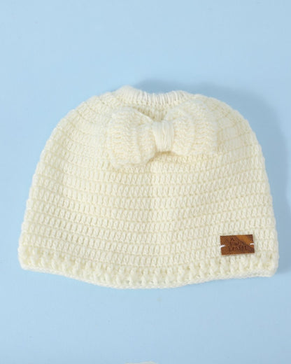 Off White Self Design Beanie Bow Handmade Knitted Woollen Cap for Girls